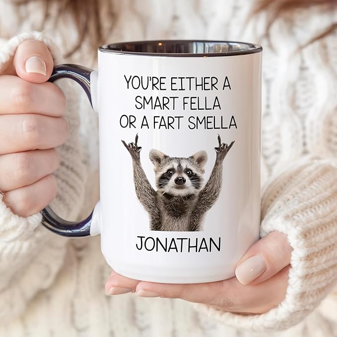 Personalized Funny Raccoon Coffee Mug – Custom Name Cup with Quote “You’re Either a Smart Fella or a Fart Smella” – Unique Gag Gift, White Elephant Christmas Cup
