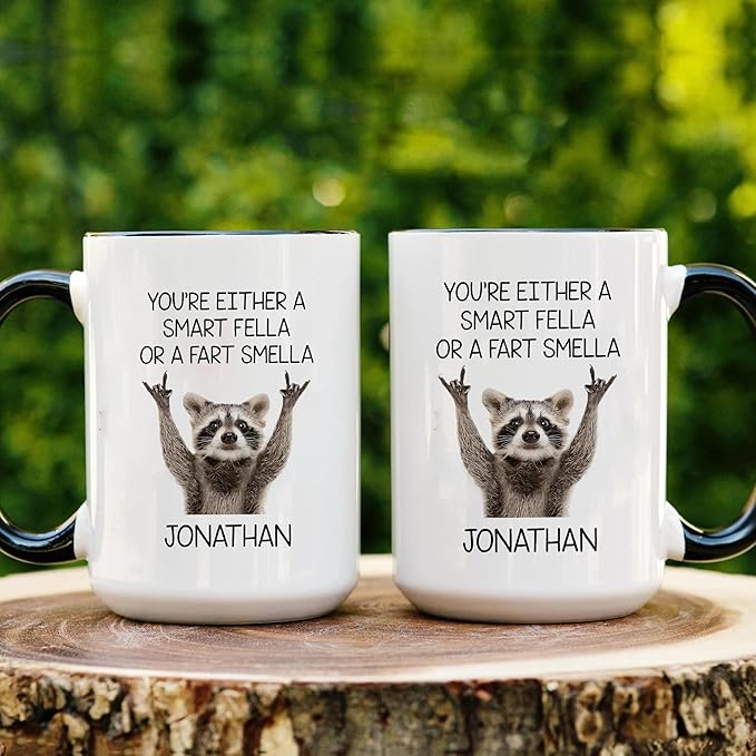 Personalized Funny Raccoon Coffee Mug – Custom Name Cup with Quote “You’re Either a Smart Fella or a Fart Smella” – Unique Gag Gift, White Elephant Christmas Cup